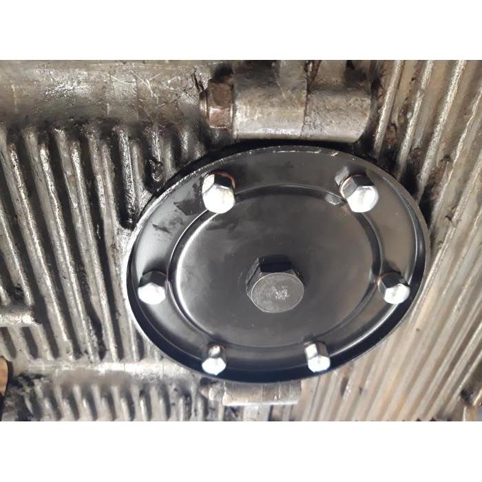 Sump plate with oil drain plug hole 