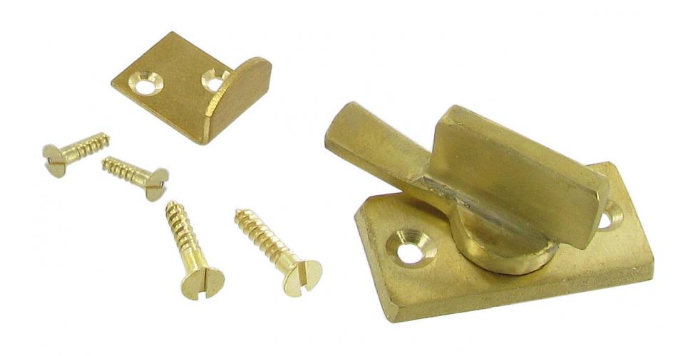 Brass cupboard door closure including catch